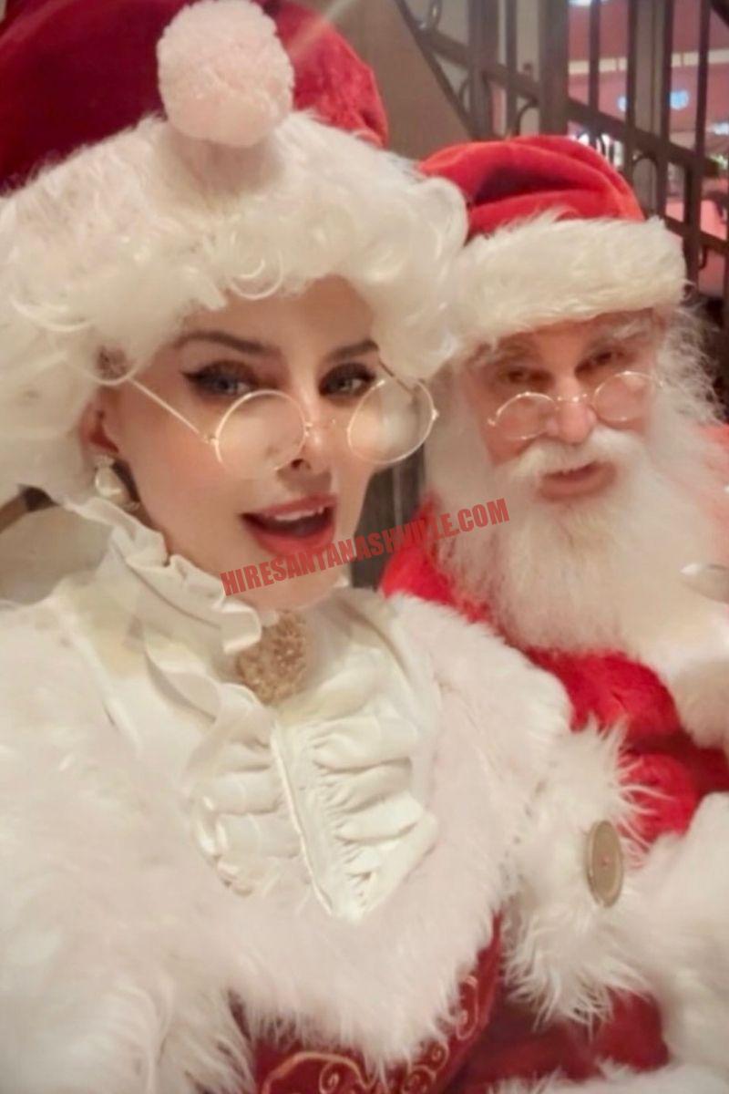 Santa and Mrs. Claus for hire in Nashville, close-up indoors in red and white costumes.